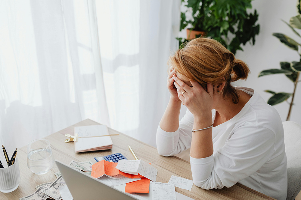 Frustrated landlord juggling papers