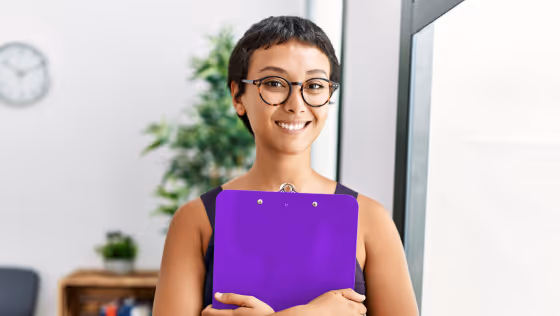 stock photo woman holding clipboard