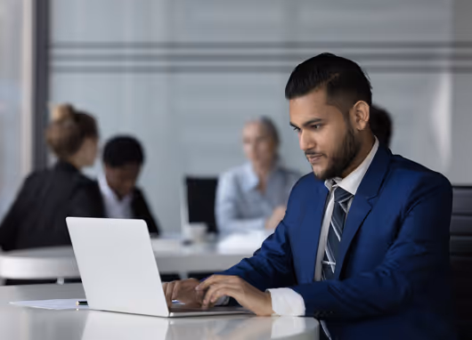 stock photo man typing on laptop