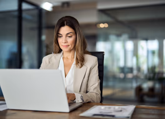 stock photo woman at desk with laptop