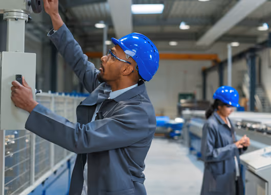 stock photo technicians in manufacturing 