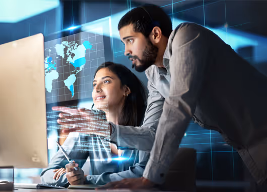 stock photo man and woman conversing at computer