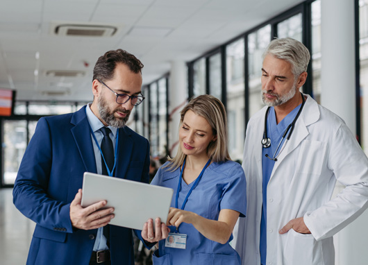stock photo medical professionals collaborating in hallway