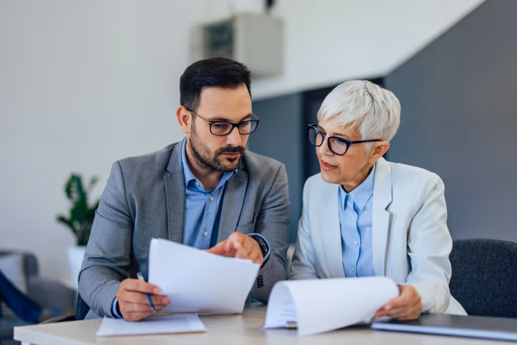 stock photo man and woman collaborating at desk