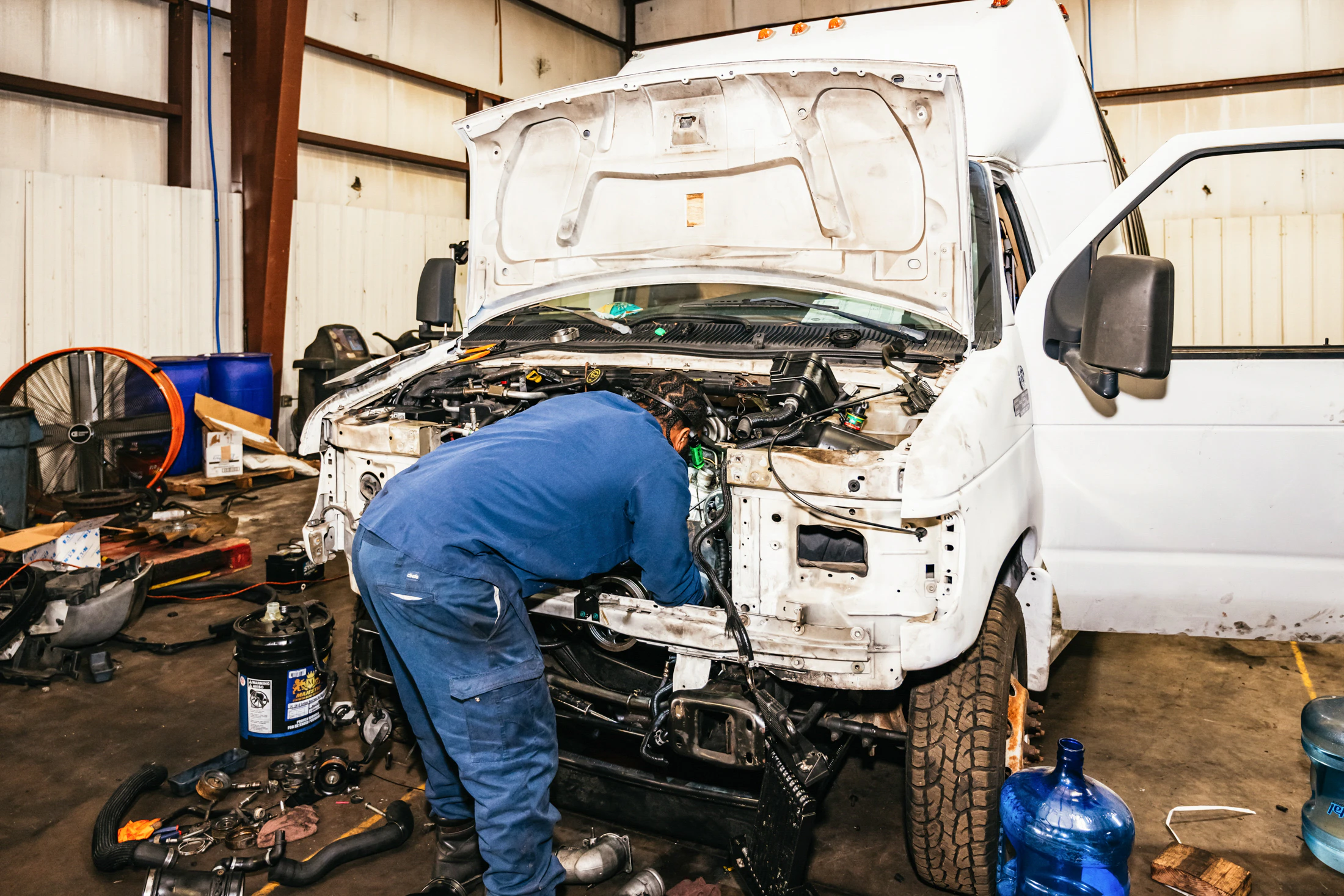 Mechanic performing truck repair in Weyburn, SK