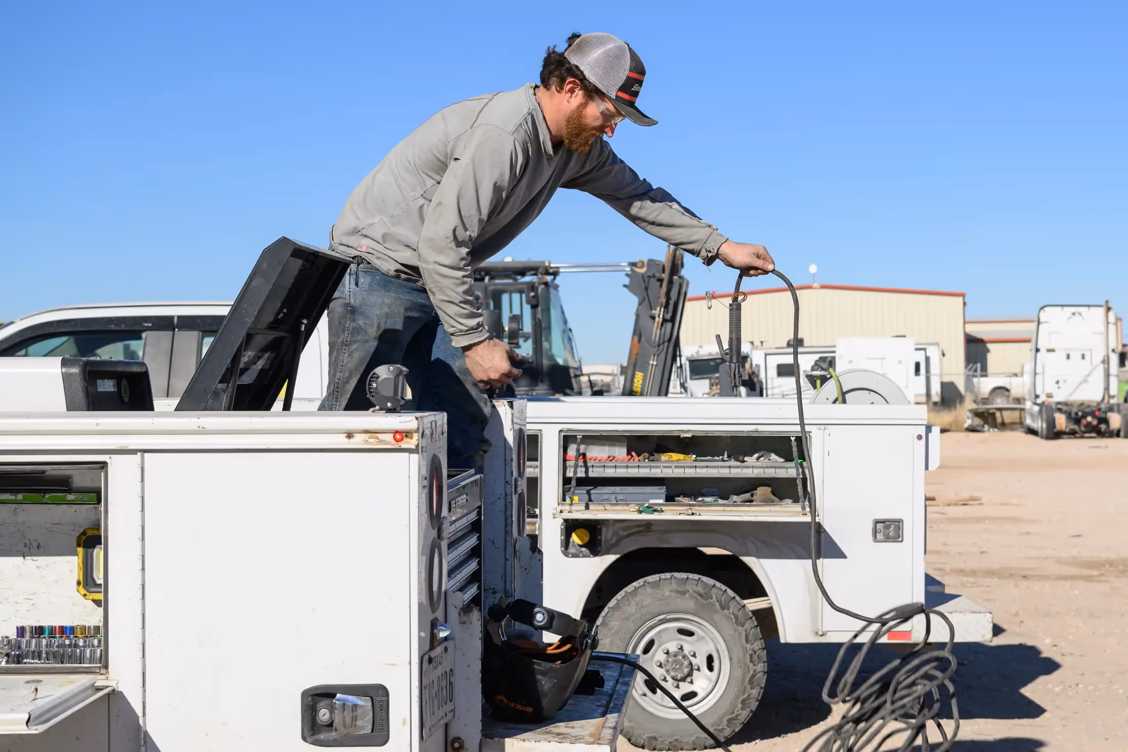 Diesel mechanic performing mobile truck repair in Weyburn, SK