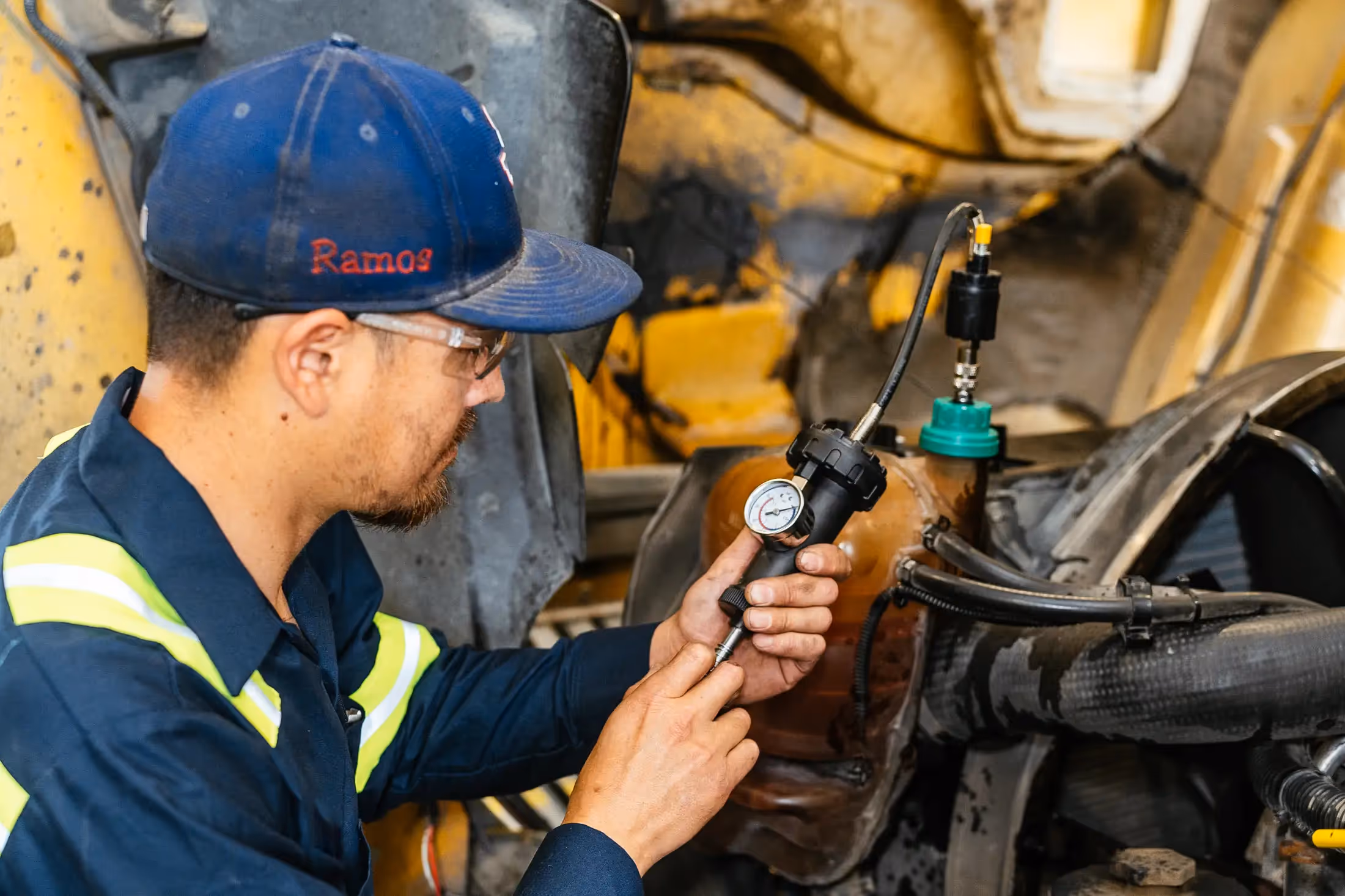 Diesel mechanic performing truck preventive maintenance in Weyburn, SK