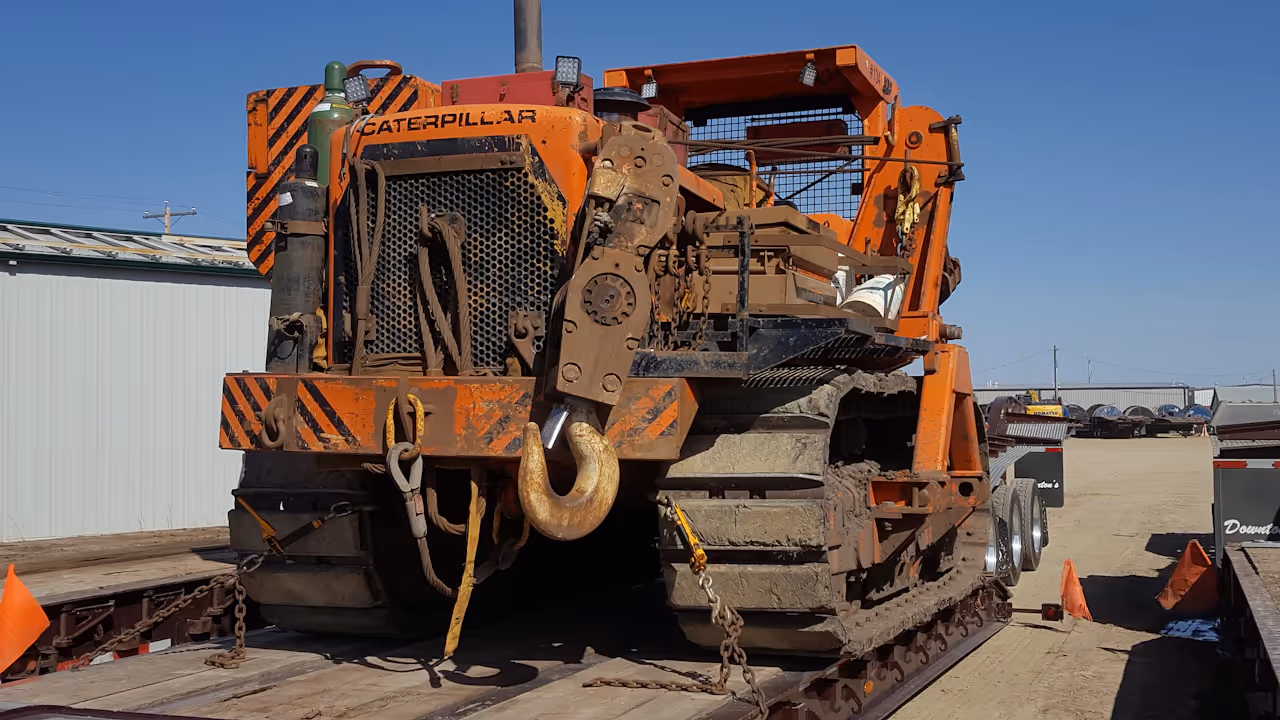 pipelayer on a lowboy 