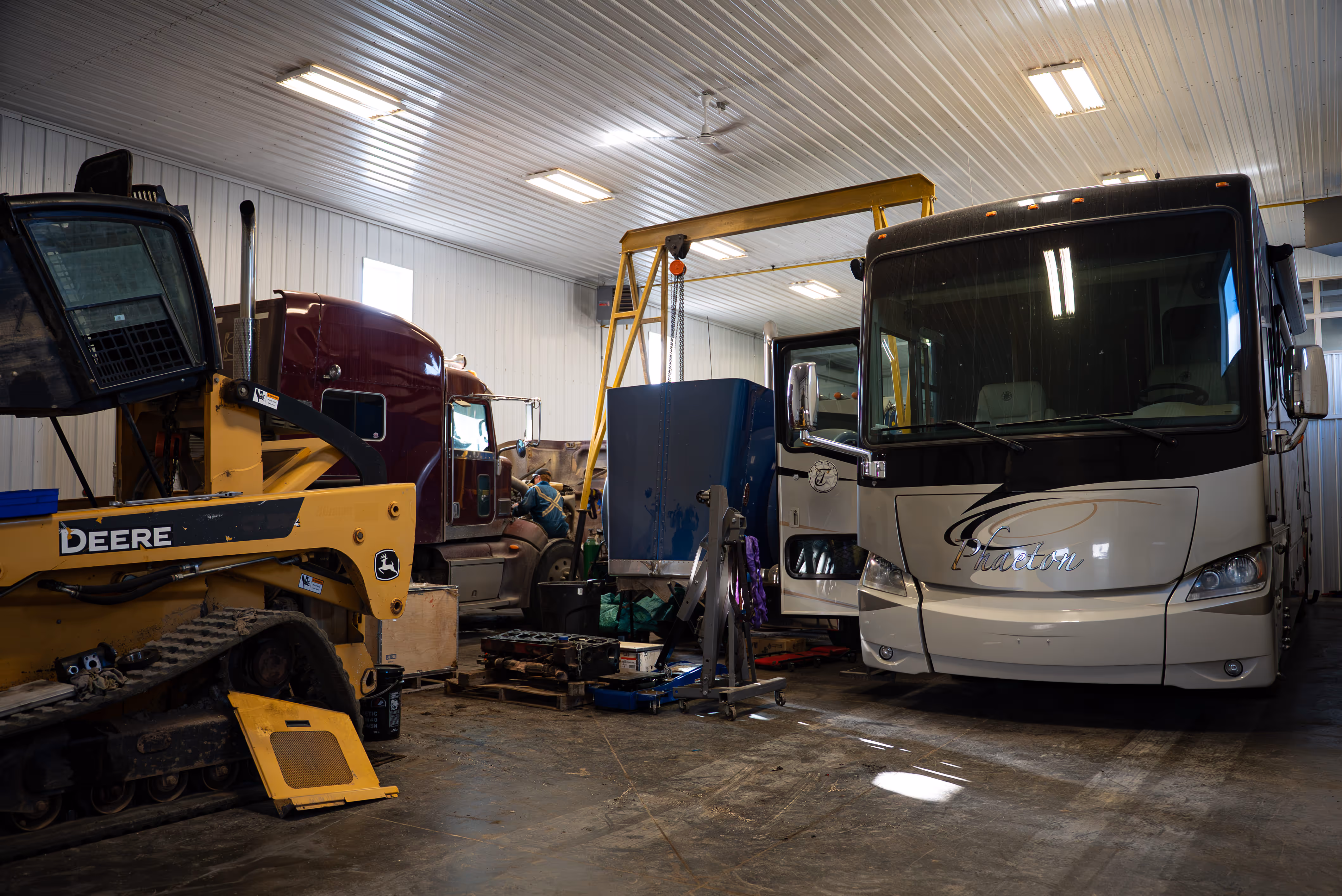 Mechanic providing bus repair in repair shop in Weyburn, SK