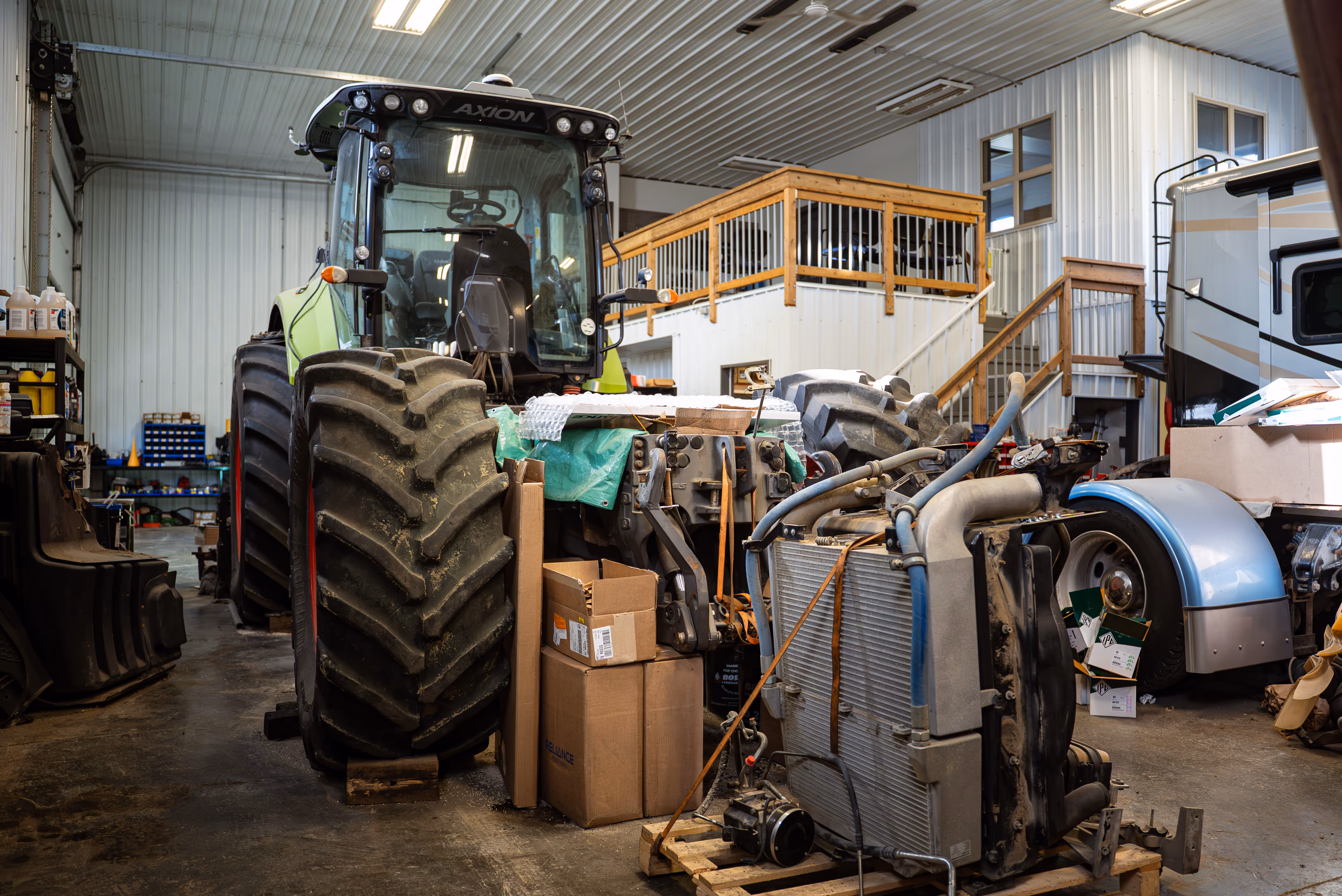 Diesel mechanic performing heavy equipment repair Weyburn, SK