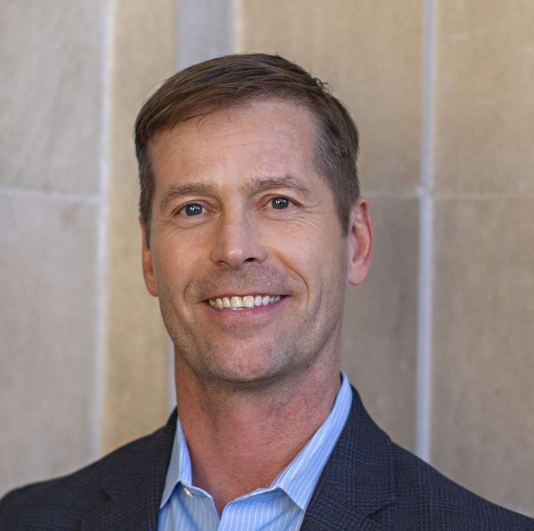 Professional headshot of Jason Ferdig, Managing Partner of StrideArc Consulting