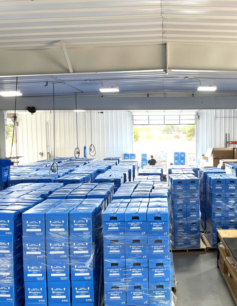 MaxQ production warehouse with blood donor tube shippers 