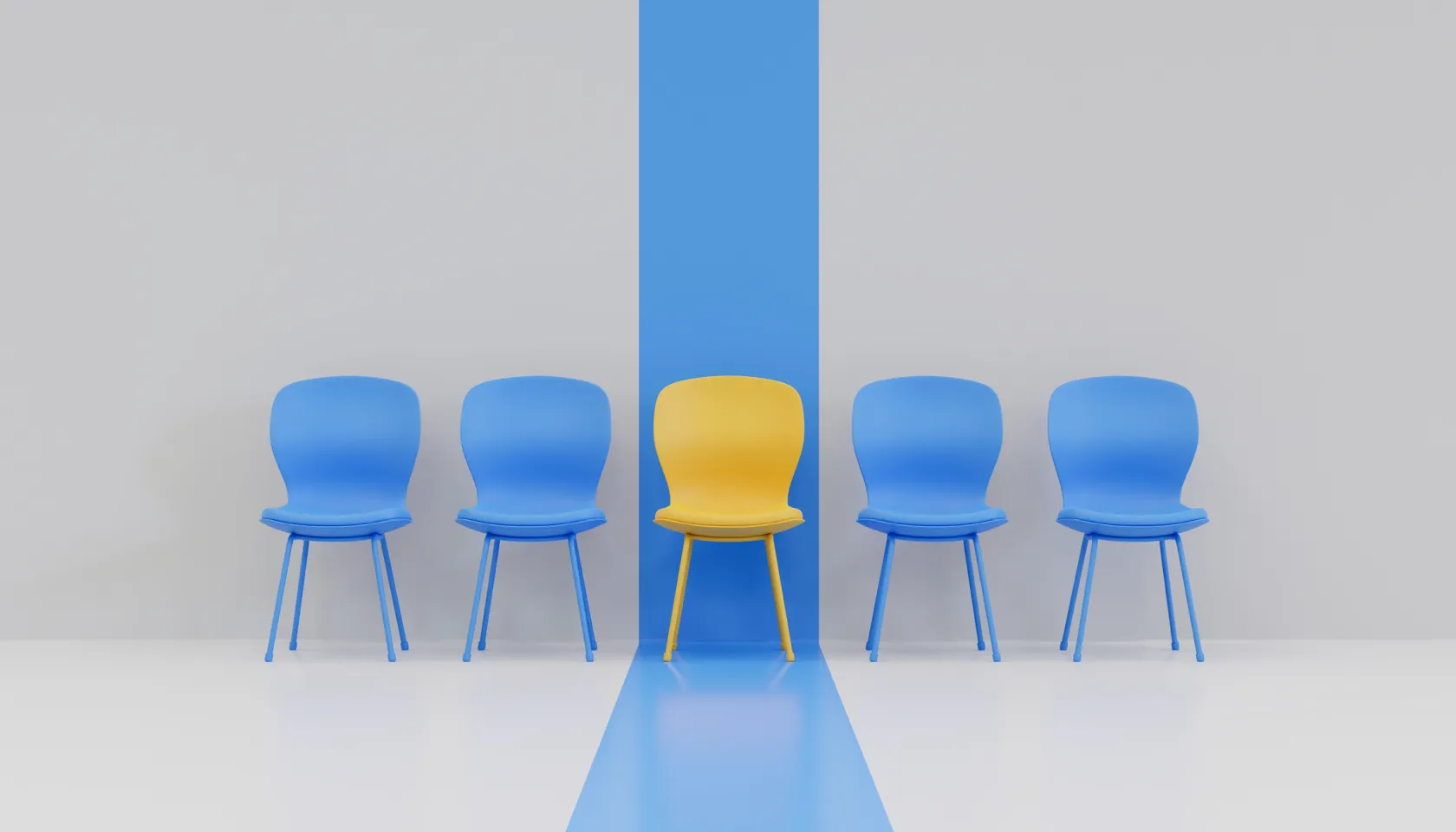 A bright yellow chair standing out in the middle of a row of blue chairs
