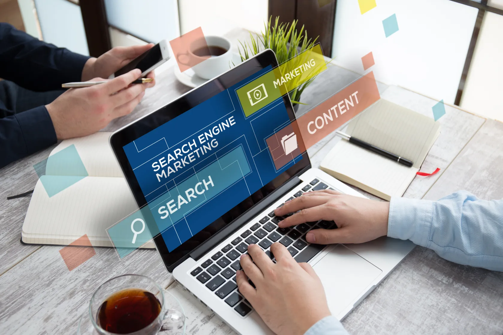 Person typing on a laptop with digital overlays showing search engine marketing, search, marketing, and content strategy concepts