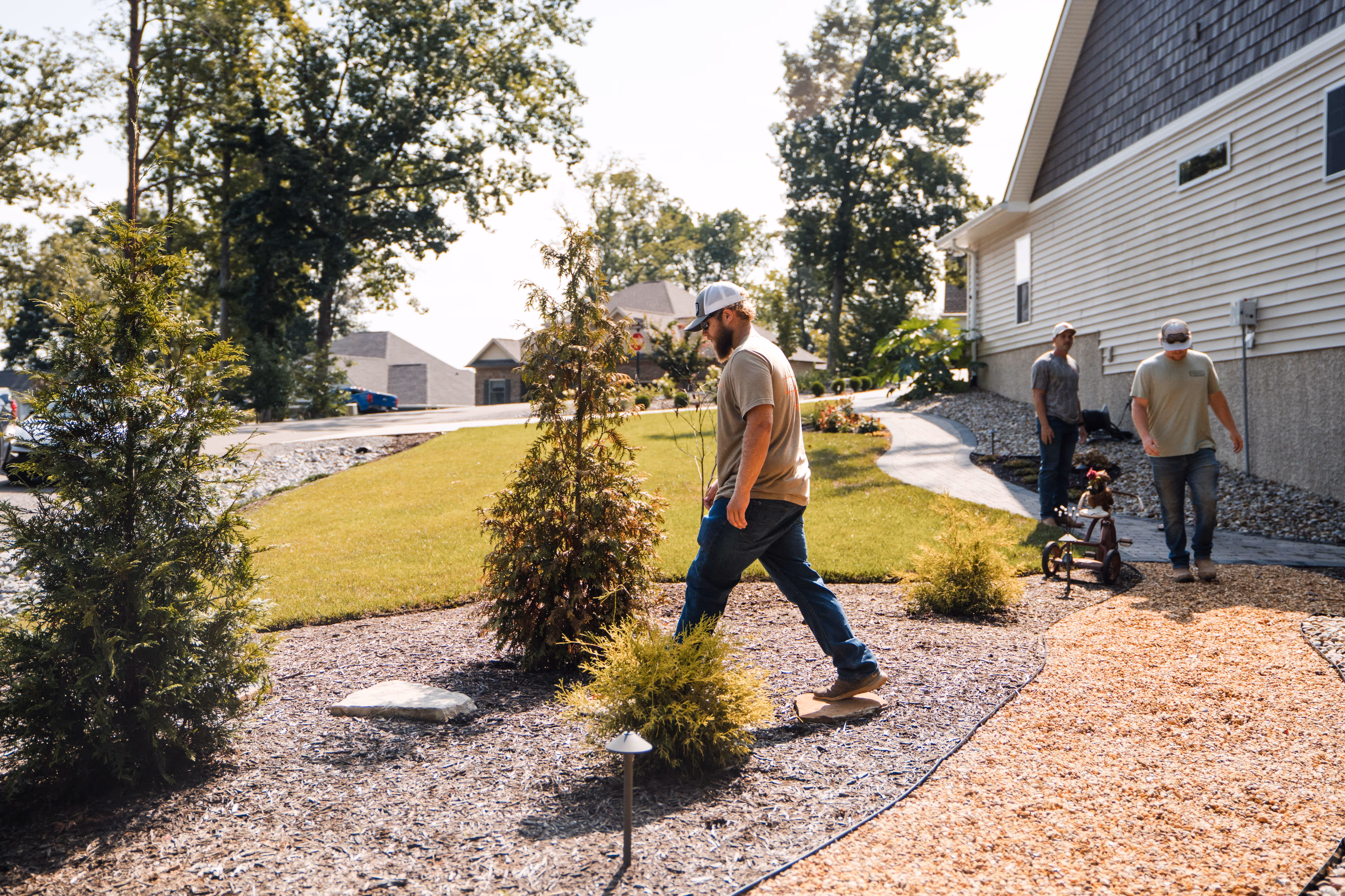 Hammel Hardscape crew walking through a yard. 