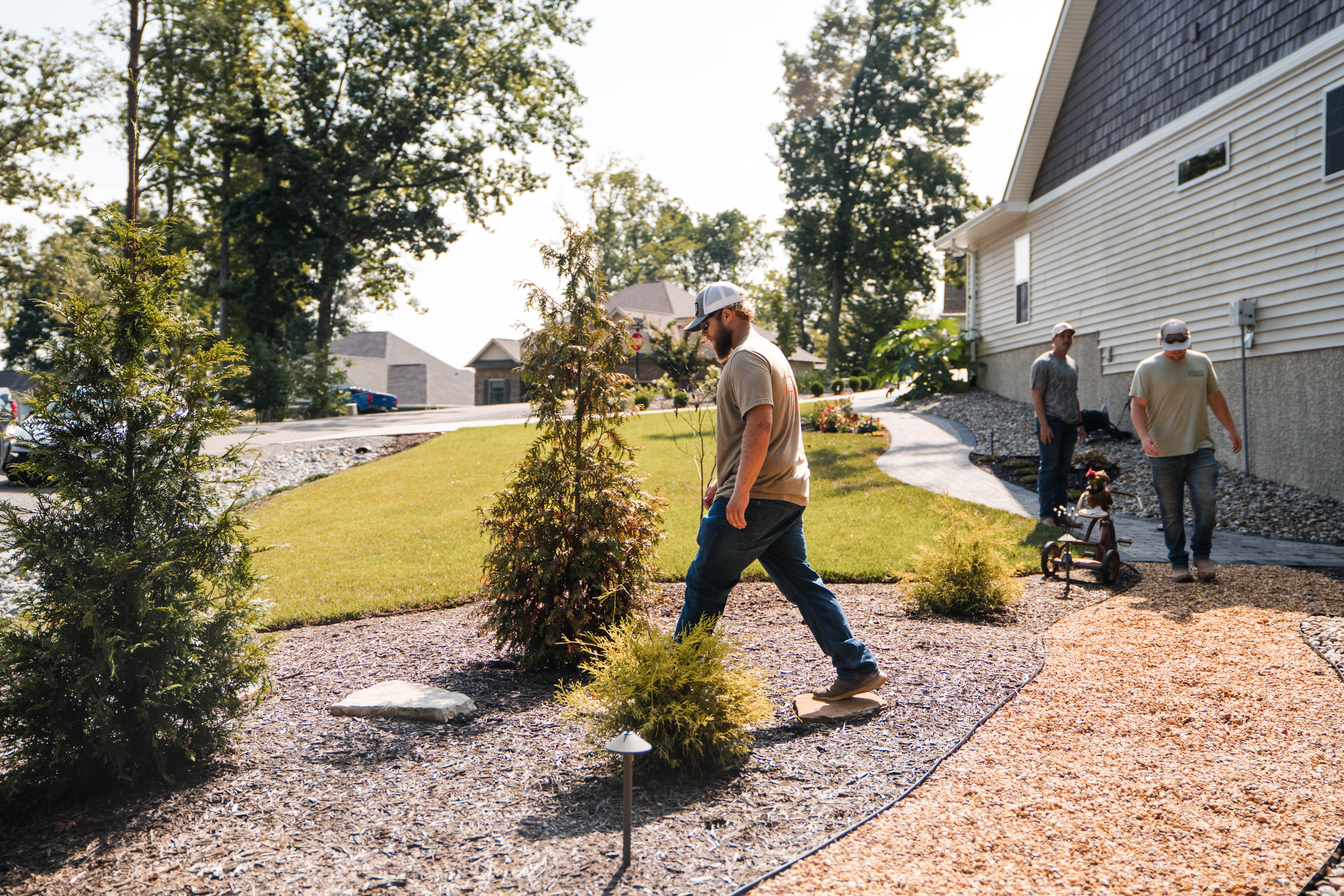 Hammel Hardscape crew walking through a yard. 