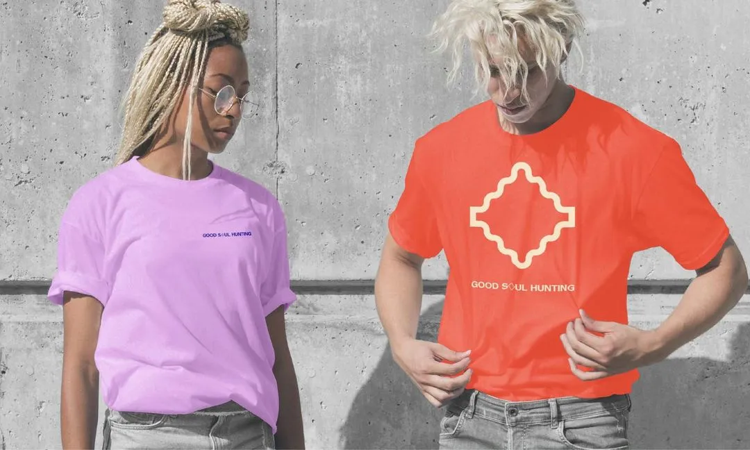 Young man and woman wearing Good Soul Hunting branded t-shirts
