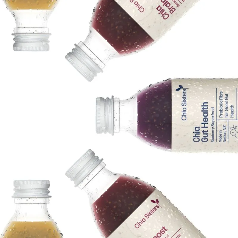 Hand picking Chia Sisters bottle out of the box