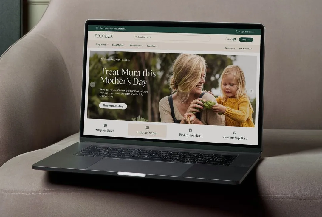 Laptop mockup of Foodbox's website homepage landing by N4 STUDIO