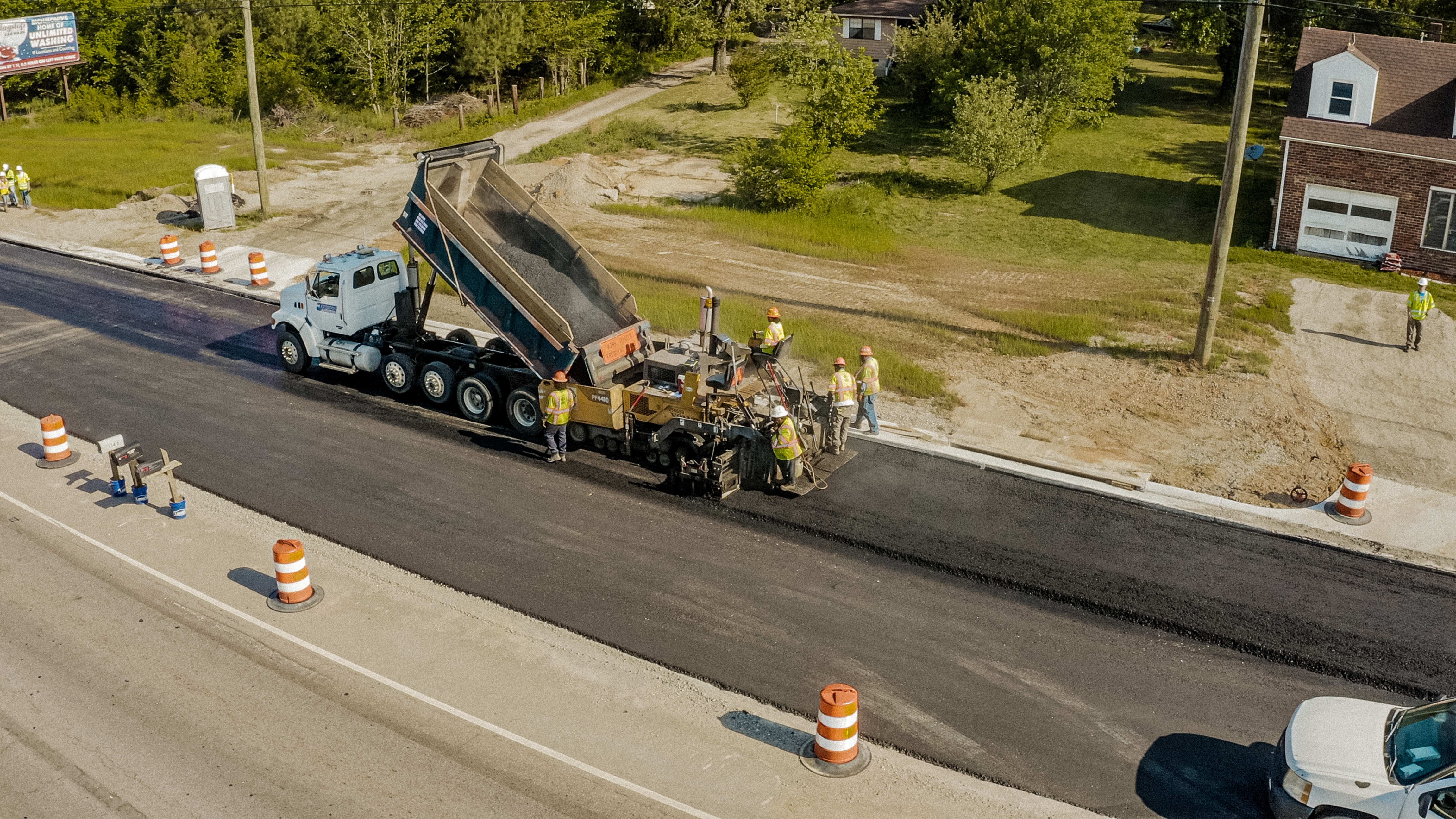 Shirley Gap 64: Dump truck feeding an asphalt paver in a closed lane.