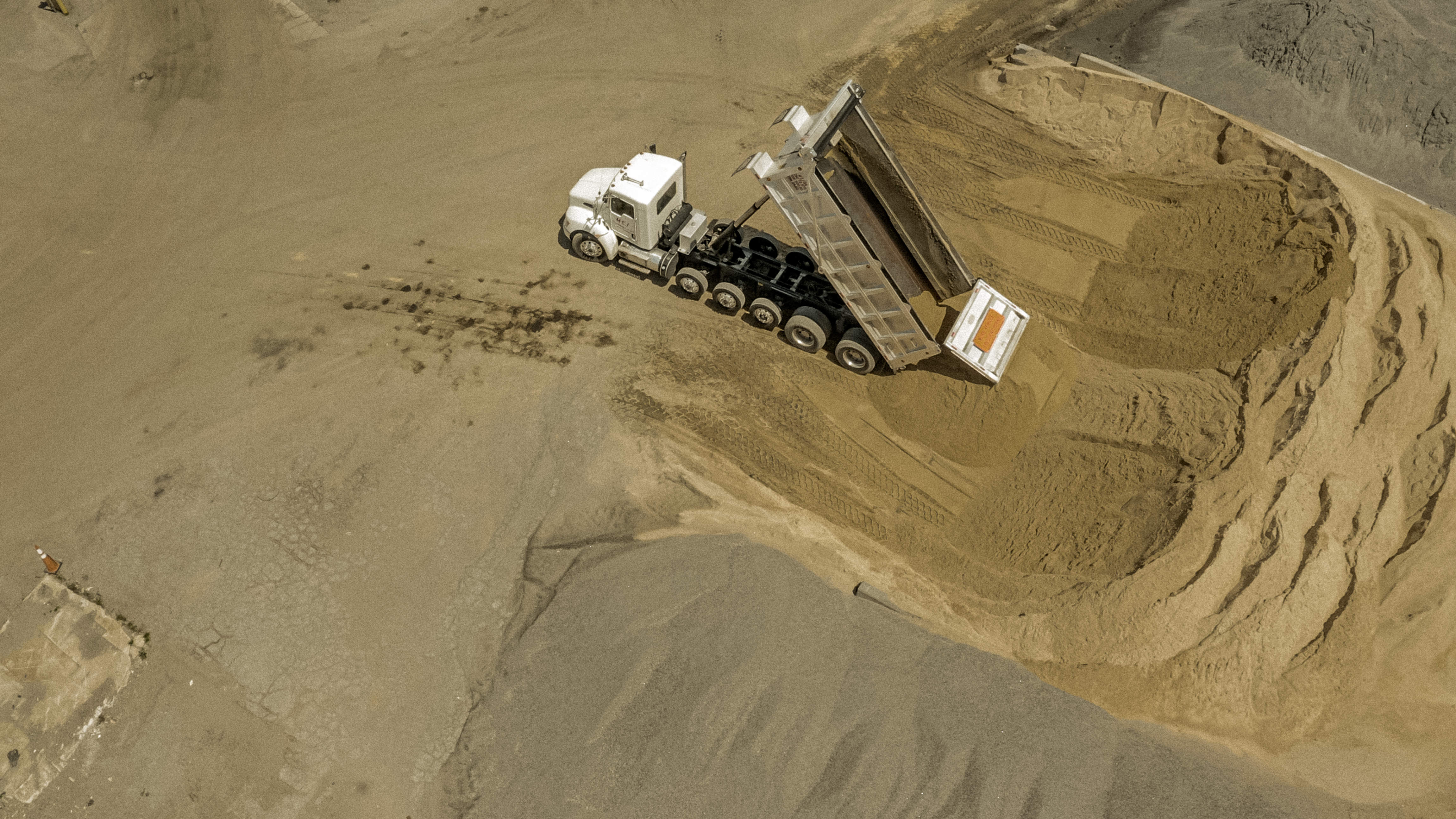 Shirley Gap 64: Dump truck tipping a load onto an aggregate stockpile.