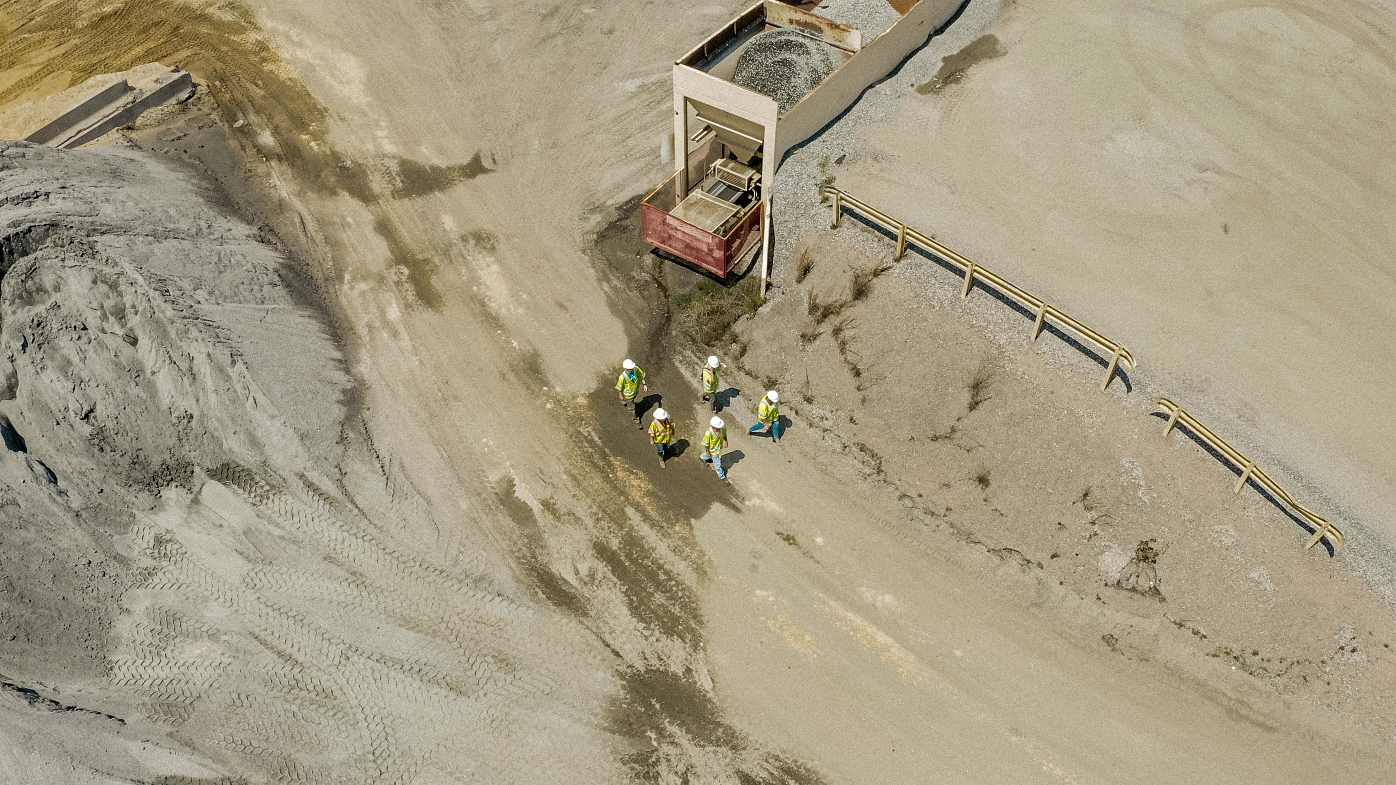 Shirley Gap 64: Workers beside aggregate processing equipment.