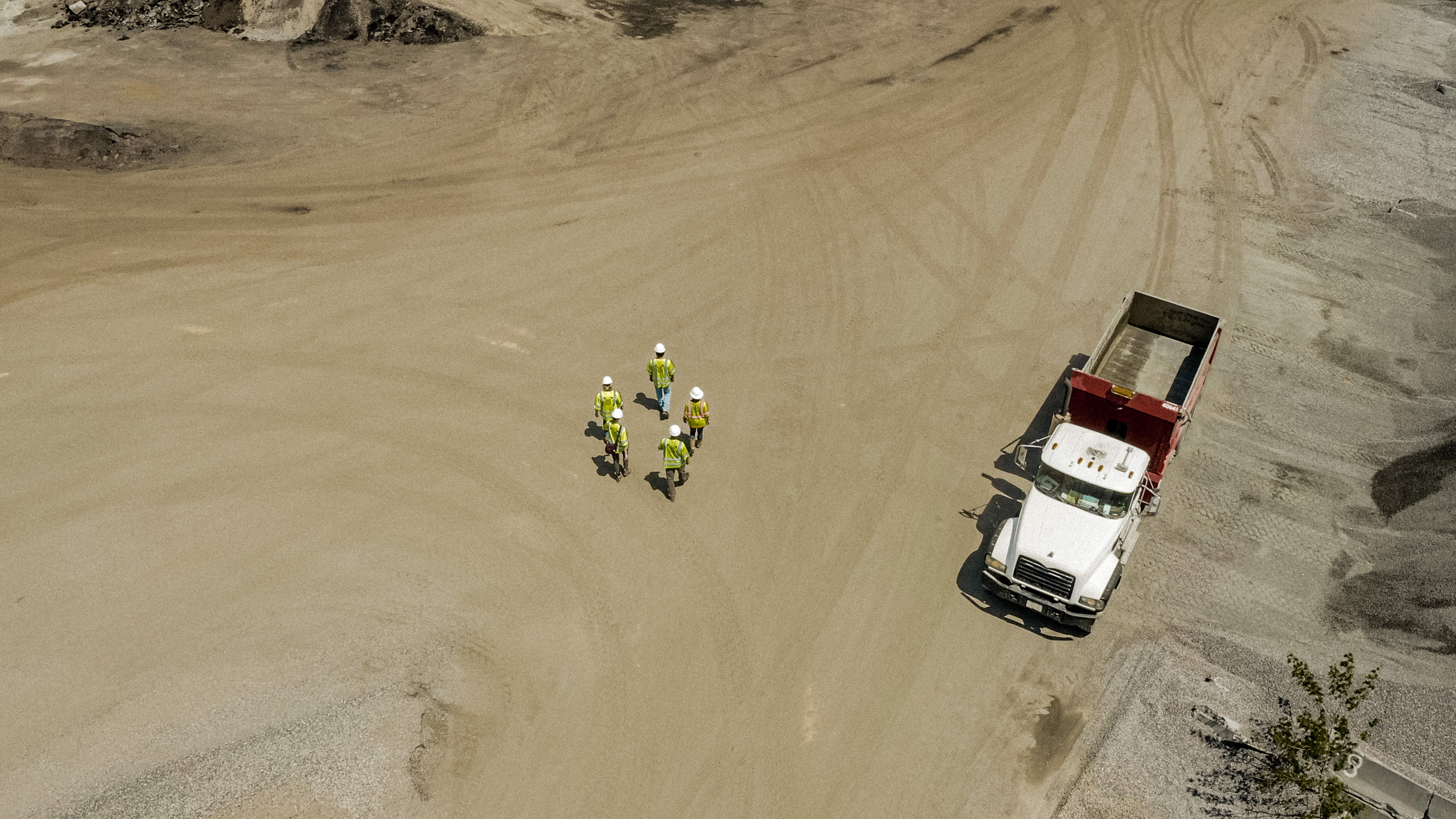 Shirley Gap 64: Dump truck and three workers on a haul road.