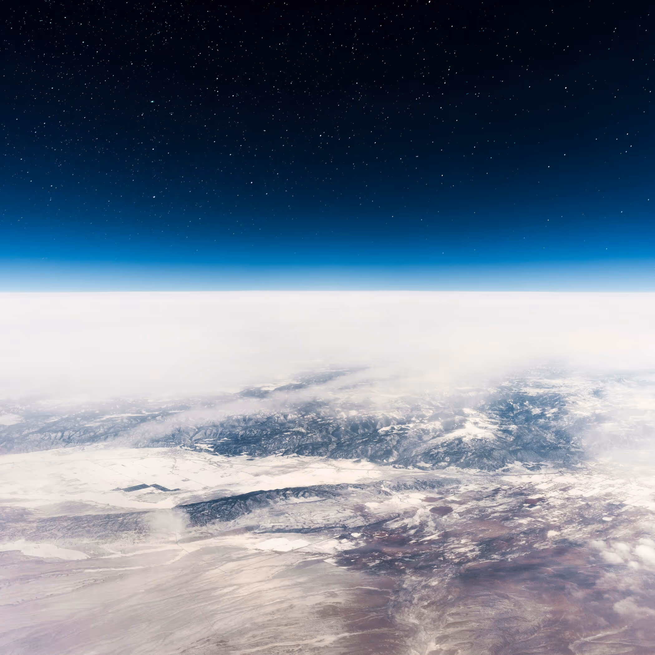 View of Earth's atmosphere and cloud formations from space