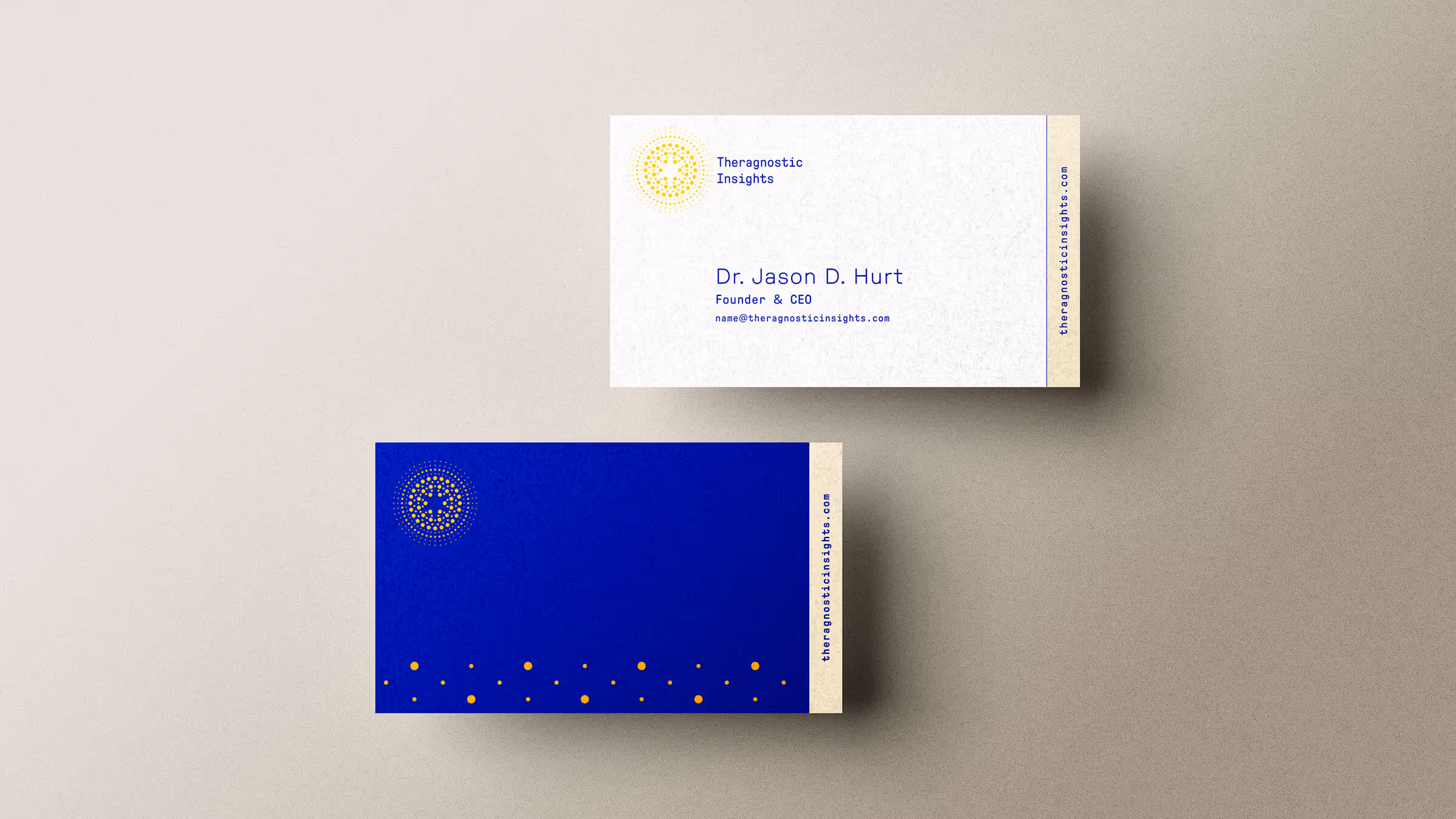 Theragnostic Insights business card system with white front and royal blue back featuring gold dot pattern