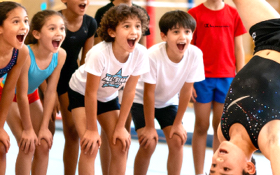 tumbling class positively supporting student doing a back handspring