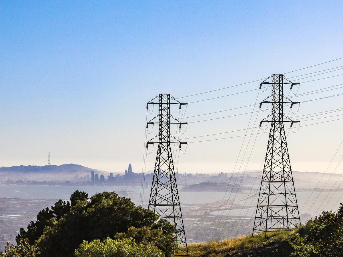 Power pylons on top of a hill overlooking San Francisco