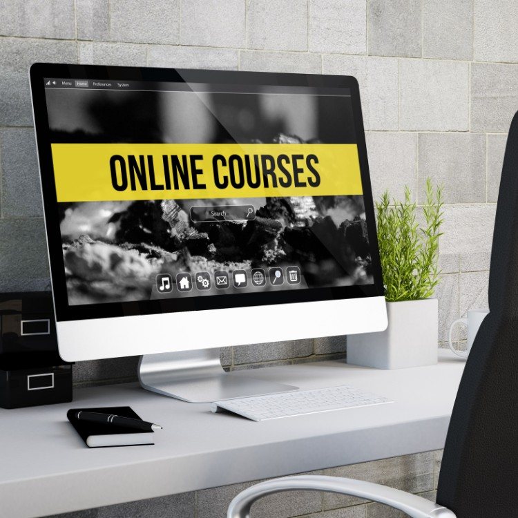 Desktop computer on an office desk displaying an online courses website