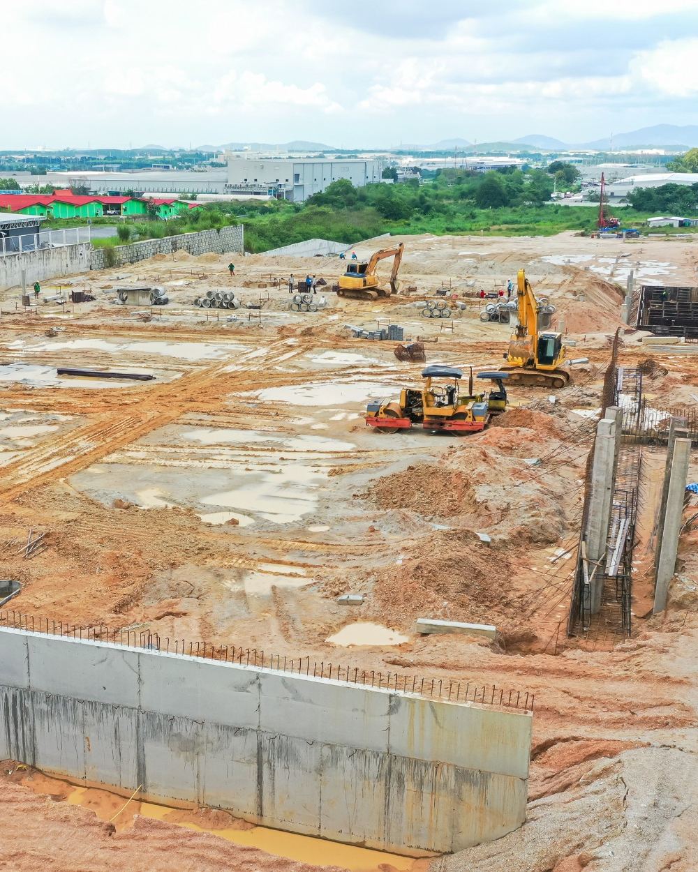 Aerial drone view of excavators working on a large construction site