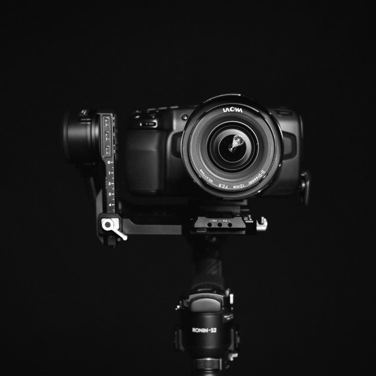 Black and white photo of a cinema camera with a wide-angle lens on a Ronin-S2 gimbal