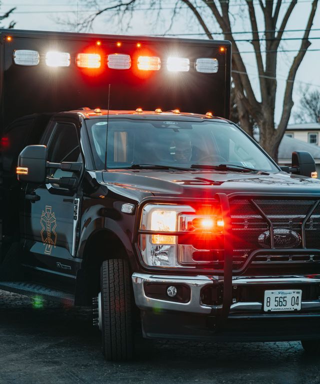 Northwest Rescue ambulance with emergency lights on, photographed by Identity Start