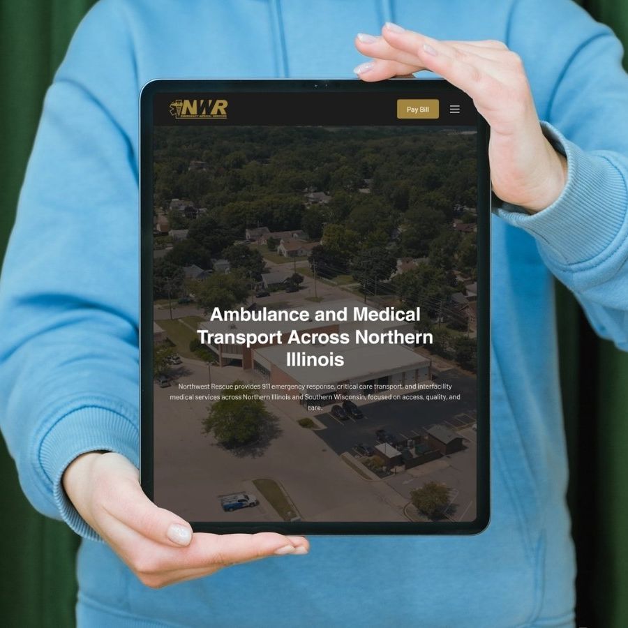Northwest Rescue website by Identity Start, shown on a tablet held in two hands