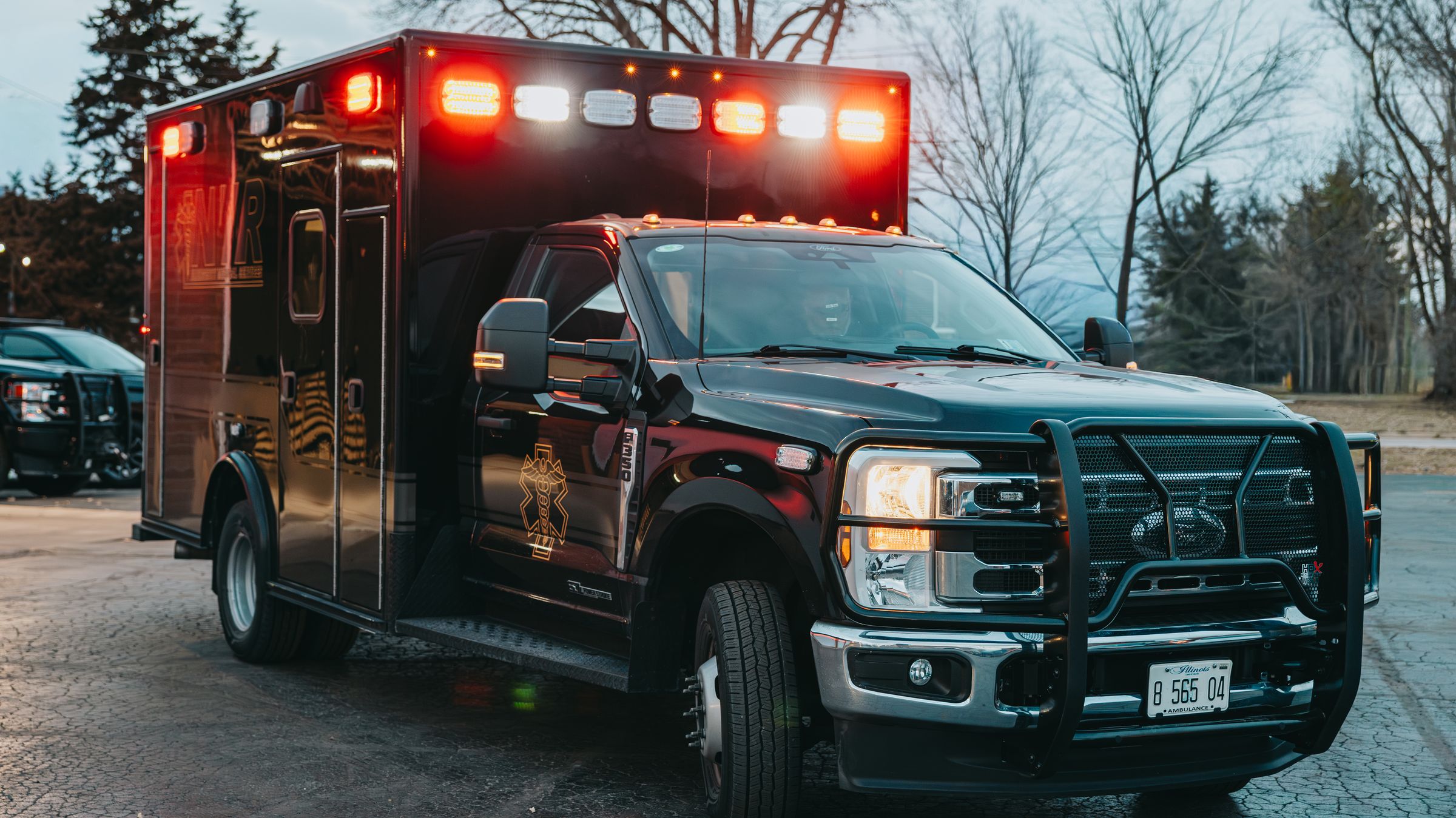 Northwest Rescue ambulance with emergency lights on at dusk, photographed by Identity Start