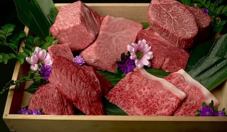 Assorted premium cuts of Japanese wagyu beef beautifully presented in a wooden box.