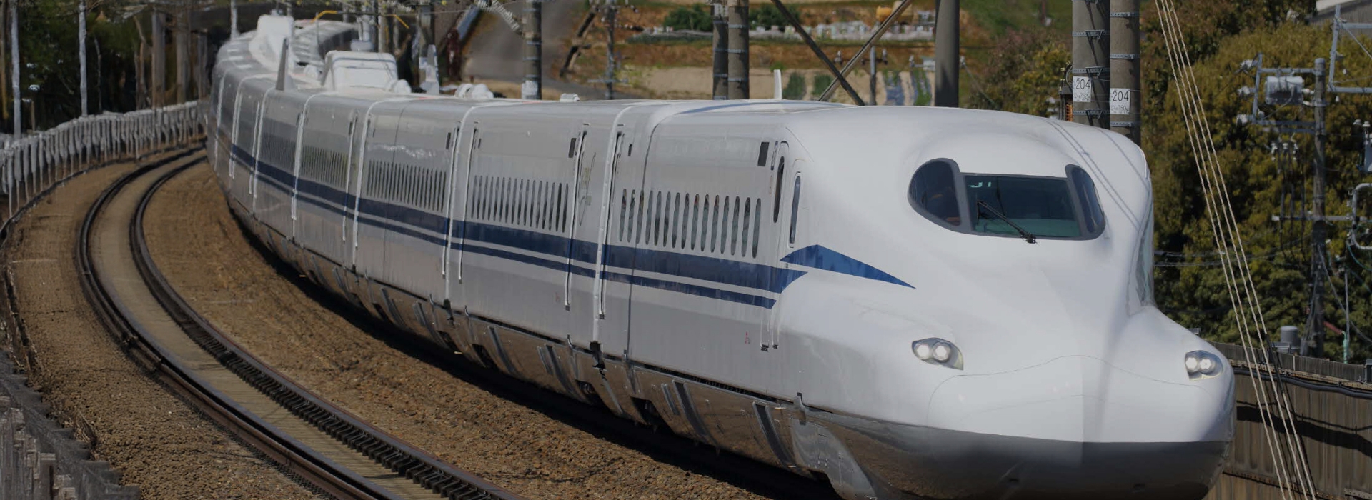 Collage of Japan’s Shinkansen bullet trains and Tokyo Station, featuring exterior views, train interior, and Mount Fuji in the background.