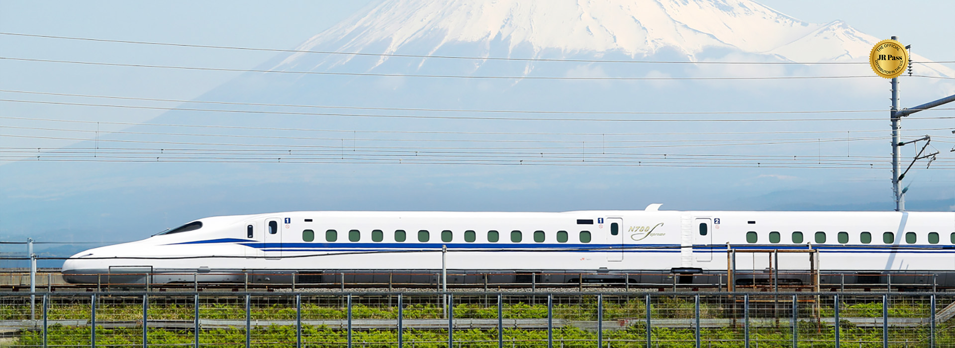 Collage of Japan’s Shinkansen bullet trains and Tokyo Station, featuring exterior views, train interior, and Mount Fuji in the background.