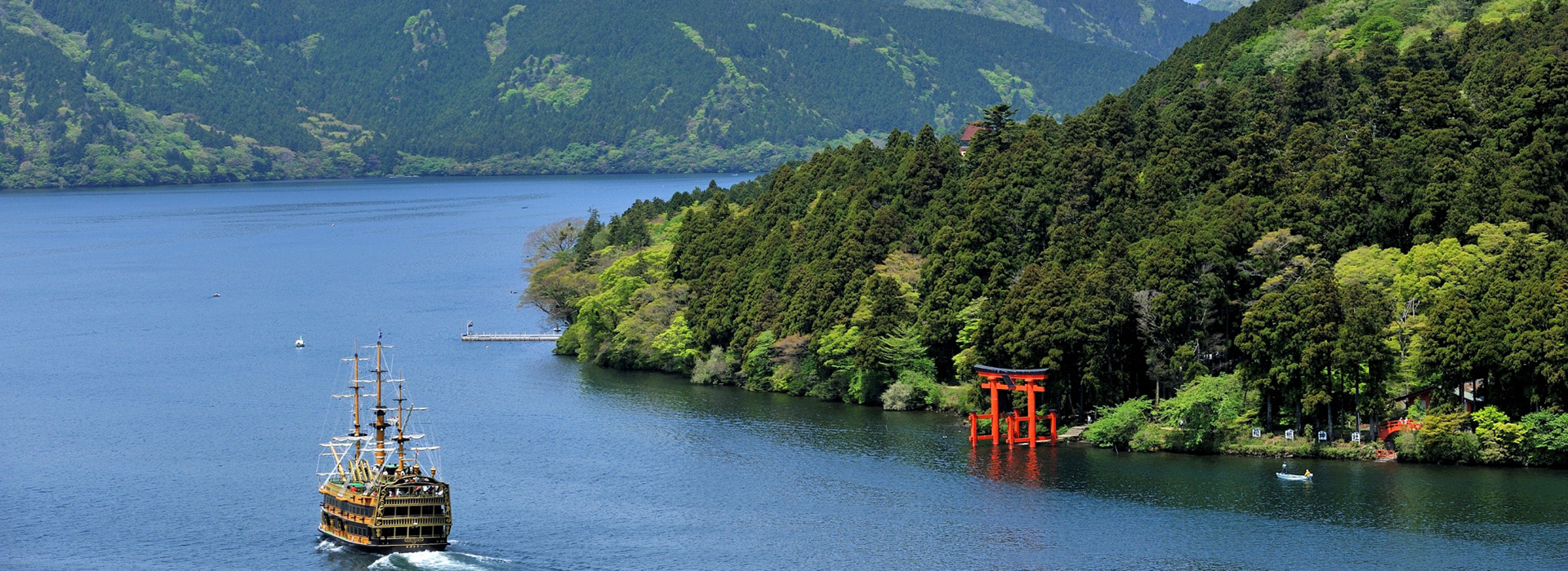 Collage of Mount Fuji and surrounding attractions: Lake Ashi with a pirate ship, autumn leaves, Chureito Pagoda, and summer beach scenery.
