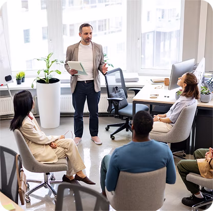 Three professional men standing outdoors in front of a modern glass building, dressed in business attire.