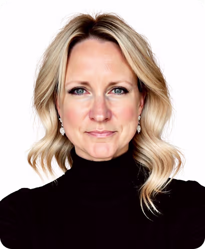 Portrait of a man in a dark suit, light shirt, and striped tie smiling against a white background.