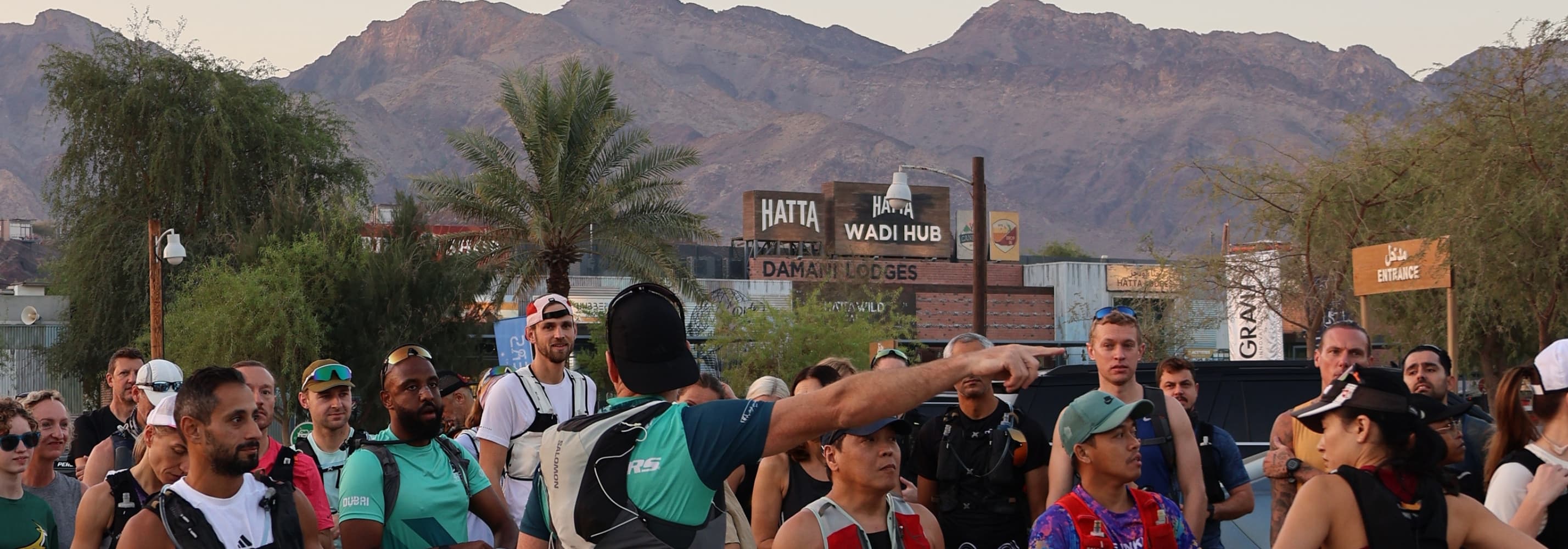 Group of trail runners infront of Hatta Wadi Hub preparing to start a trail run.