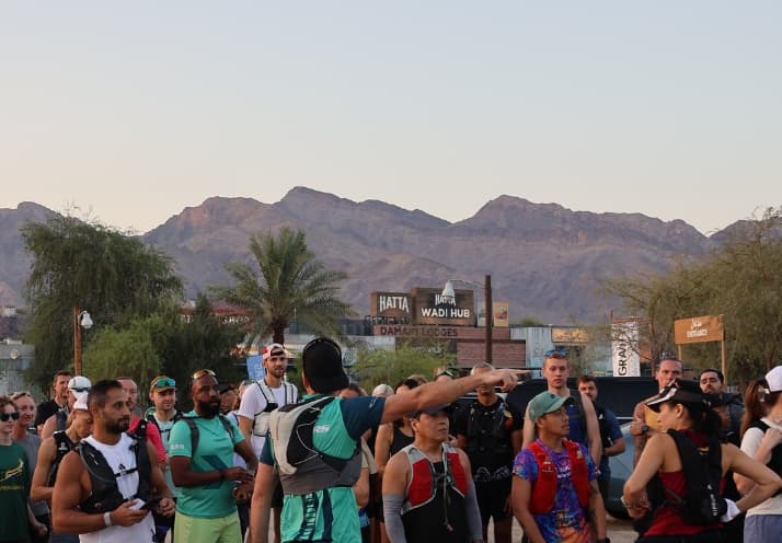 Group of trail runners infront of Hatta Wadi Hub preparing to start a trail run.