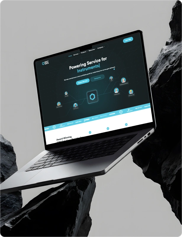 Flowfye B2B instrument services website design with a dark teal layout and cyan accents, displayed on a laptop.