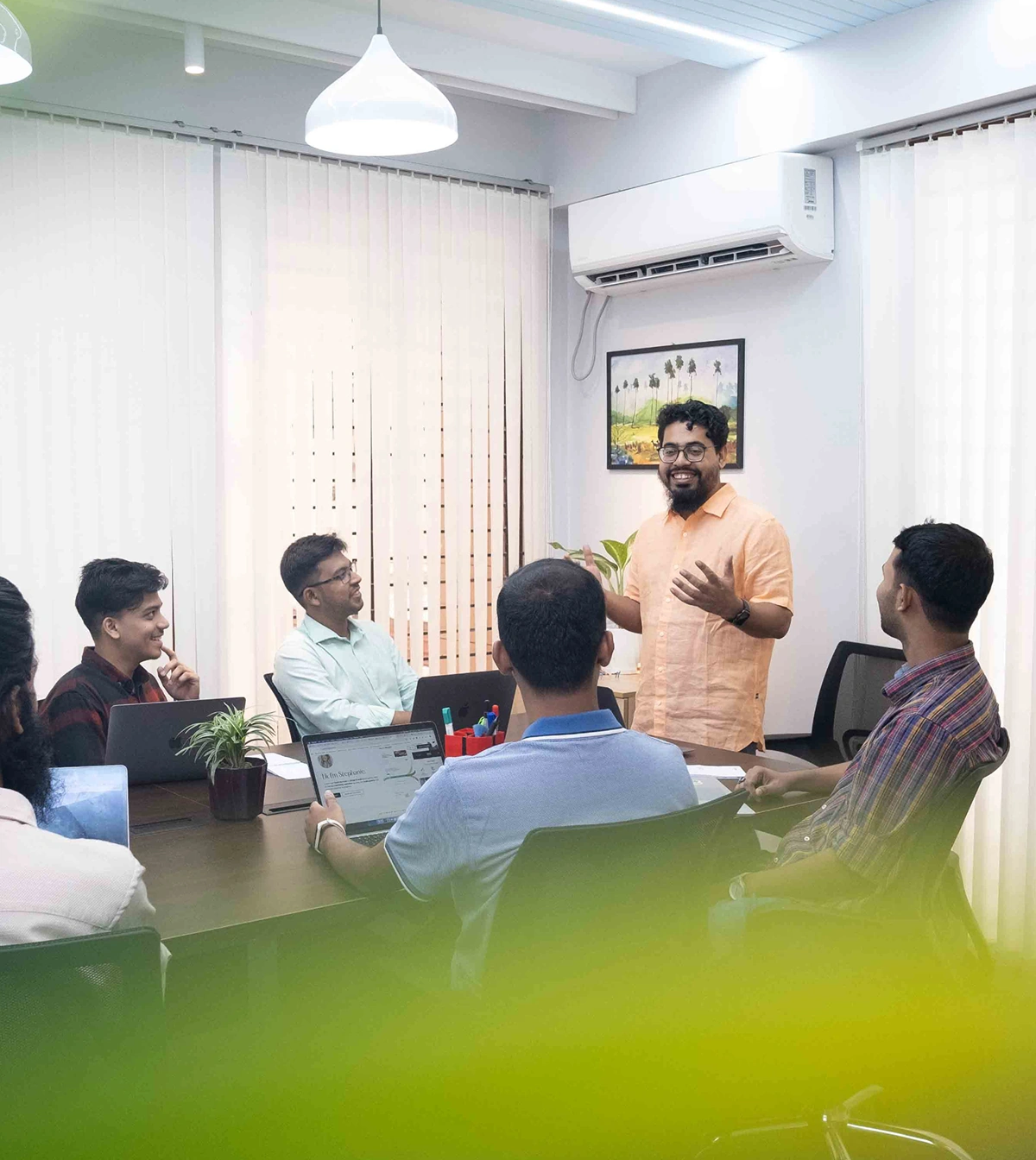 Flowfye team discussing website strategy, design and development during an office meeting.