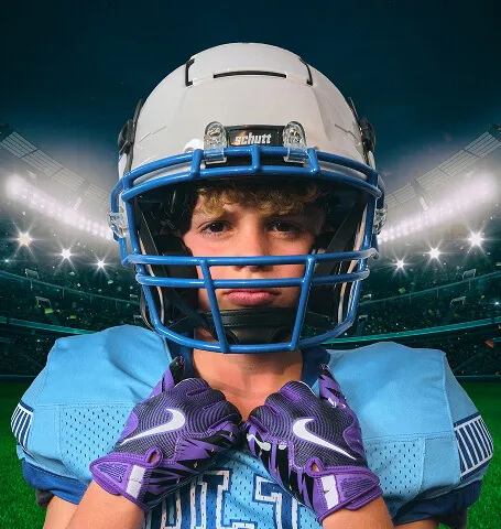 Calgary youth football player in full gear posing for a dramatic stadium-style composite portrait created by Media&Motion during a sports media day.