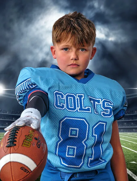 Calgary youth football player from the Colts posing for an intense stadium-style close-up portrait created by Media&Motion during a sports media day.
