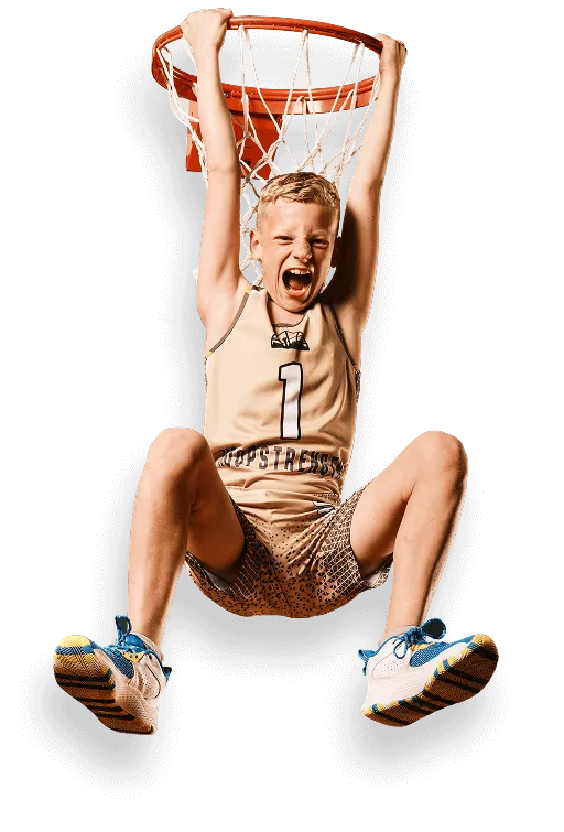 Dynamic action portrait of a Calgary youth basketball player hanging from the rim during a Media&Motion Media Day shoot.